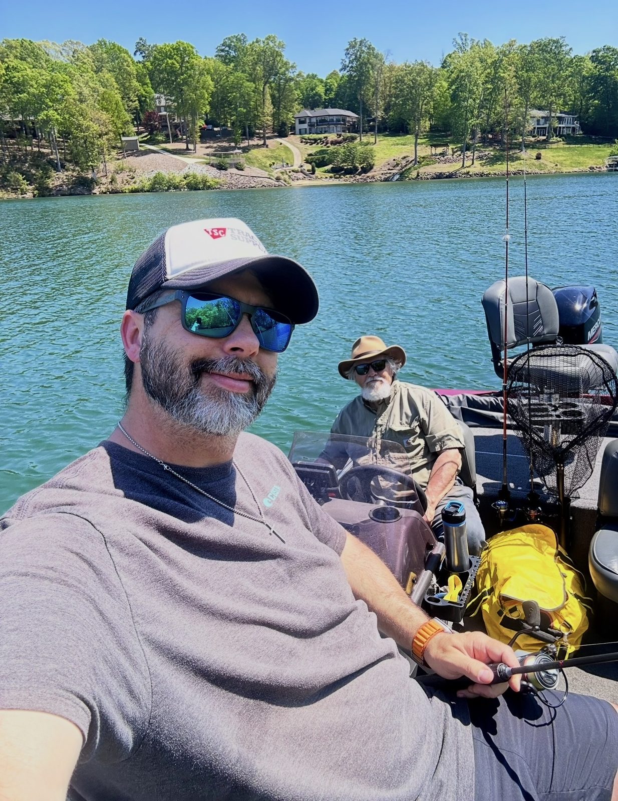 Matt and a companion on a fishing boat